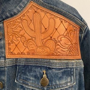 Beautiful hand-tooled leather patch denim Carhartt jacket. Size Medium